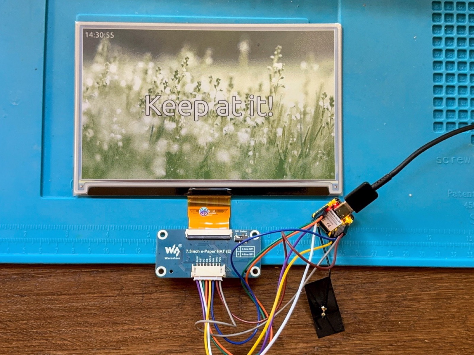 A Seeed XIAO ESP32-S3 driving a 7.3" Waveshare e-ink panel